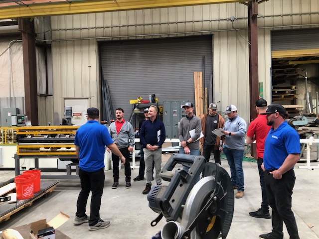 group of people learning about metal fabrication equipment at a training course at metal formers in mt juliet