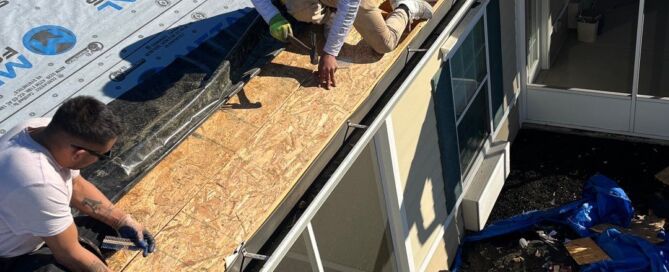 Metal Former workers installing underlay on home