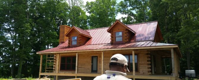A red Metal Formers roof on a house.