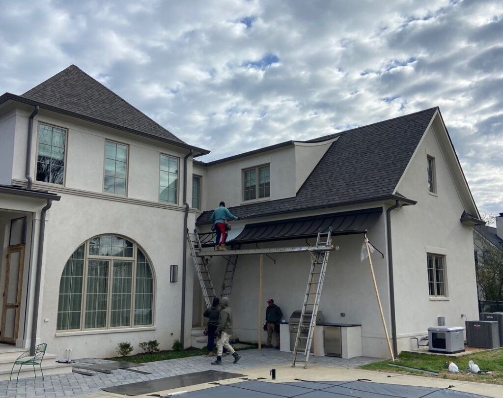 Metal Formers employees installing a metal roof.