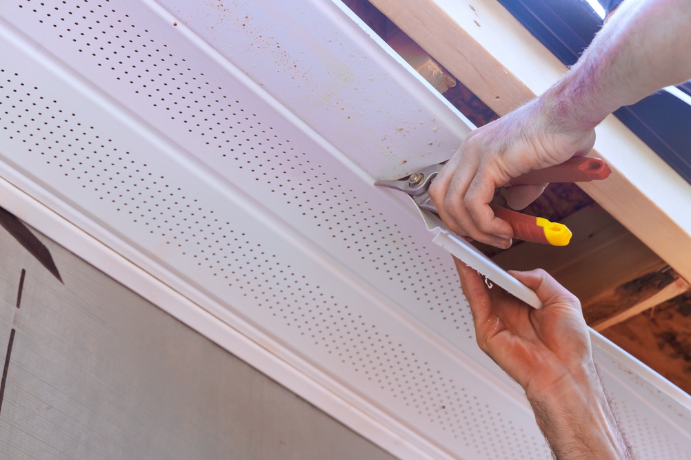 Hands,Work,To,Fit,Ceiling,Soffit,Panels,Trim,While,Using